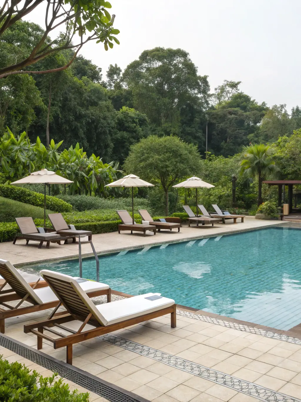 A photograph showcasing a pool with crystal-clear water after professional tile cleaning, highlighting the importance of maintaining water quality and hygiene.